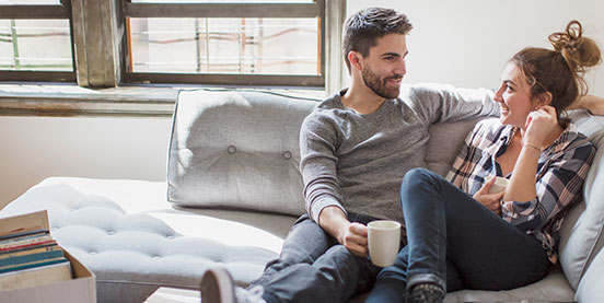 couple on a sofa with coffee